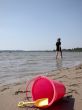 pink bucket on beach