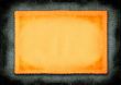 piece of yellowed paper against material background