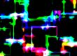 abstract of shop lights through a rainy windscreen