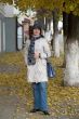 woman in autumn city street.