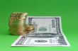One hundred dollar note with coins