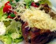 baked potato with cheese and salad