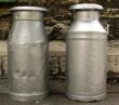 Two old milk churns