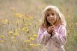 little girl in the filds flowers