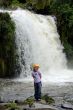 little girl near mountains waterfall
