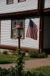 American flag and classic New England House