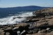 Breaking waves on granite ledges