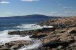 Breaking waves on granite ledges