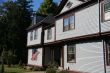 American flag and classic New England House