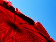 red parasol and blue sky