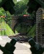 Railway tunnel framed by nuts and bolts