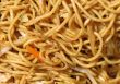A squiggle of noodles with a little carrot