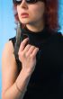 redhaired woman with pistol