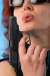 redhaired woman with pistol