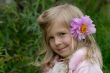 the little girl with a flower in hair