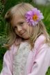 the little girl with a flower in hair