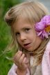 the little girl with a flower in hair