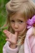 the little girl with a flower in hair