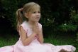 praying girl on the grass