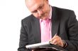 Concentrating on his notes