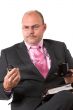 Businessman checking out the display on his phone