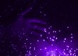 hand and purple fibre optic