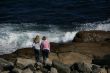 Young girls on beach rock