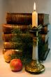 The Christmas candle and old books.