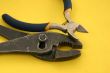 close-up of pliers on yellow