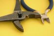 close-up of pliers on yellow