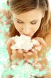 smelling rose petals in water with flowers