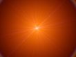 radiating pinpoint of orange light
