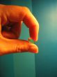 hand and capsule