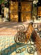 Garden bench before the entrance in the cafe