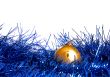 yellow ball lies on new-year tinsel