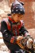 young asian girl selling beads