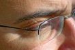 close up of eye and glasses