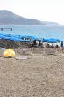 Beach with blue umbrellas