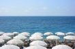 Beach with white umbrellas