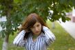 Beauty brunette in a park correct you hairstyle #2