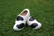 Wooden shoes with cow print.