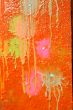 Multicolored blots and stains on wooden surface