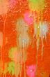 Multicolored blots and stains on wooden surface