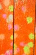 Multicolored blots and stains on wooden surface