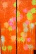 Multicolored blots and stains on wooden surface