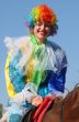 Equestrian clown in colored wig