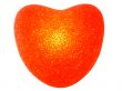 Burning plastic heart on the white background