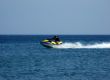 The men goes for a drive on a wave runner
