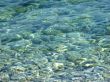 pebbles under a blue surface of sea water