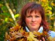 woman with autumn leaves